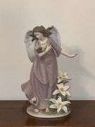 Angel with lilies and roses statue
