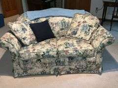 Sealy floral love seat with throw and throw pillows