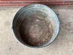 Galvanized tub, no handles, rust in bottom
