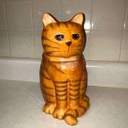 Expressions yellow cat cookie jar