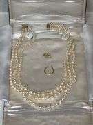 Triple strand of pearls with 14K gold clasp