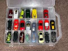 Assortment of toys, Nerf guns, cars, trucks