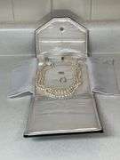 Triple strand of pearls with 14K gold clasp