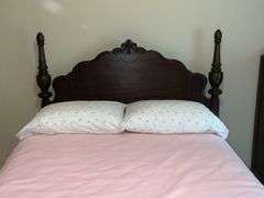 Antique four-poster bed, damage to one side rail