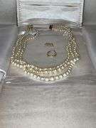 Triple strand of pearls with 14K gold clasp