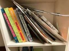 Assortment of sheet music and music books