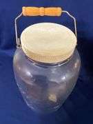Mason's large glass jar with bail handle, cracked plastic lid