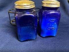 Cobalt blue salt & pepper shakers in wire caddy