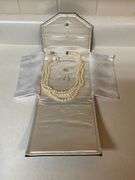 Triple strand of pearls with 14K gold clasp