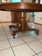 Oak single pedestal dining table, split in top