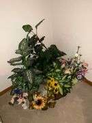 Assortment of artificial flowers and planters