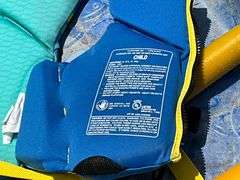 Pair of pool ladders, kiddie pool, life vests child's 30-50 lb. and 50-90 lb.