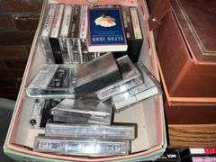 Assortment of music cassettes and CDs
