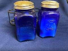 Cobalt blue salt & pepper shakers in wire caddy