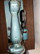 Universal DeLuxe sewing machine in cabinet Model G.B. with accessories