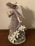 Angel with lilies and roses statue