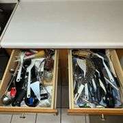 Assortment of kitchen utensils, corkscrew, spatulas, spoons, spaghetti server, juicer