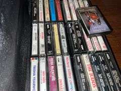 Assortment of music cassettes and CDs