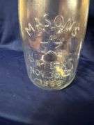 Mason's large glass jar with bail handle, cracked plastic lid