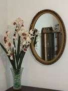 Oval ornate framed mirror, 27" x 18 1/2"