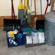 Snow shovel, rake, mop, yard sticks, trash bags, ice melt, galvanized trash can, fire extinguisher