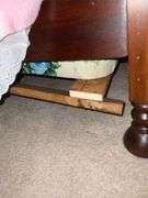 Antique four-poster bed, damage to one side rail