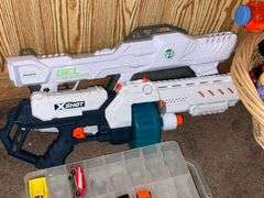 Assortment of toys, Nerf guns, cars, trucks