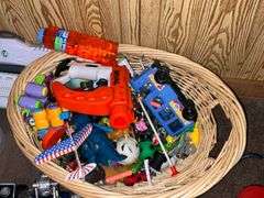 Assortment of toys, Nerf guns, cars, trucks