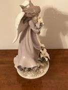 Angel with lilies and roses statue