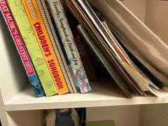 Assortment of sheet music and music books