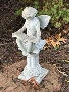 Fairy reading on a column