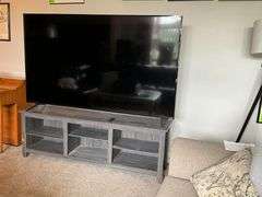 Vizio flatscreen Smart TV with remote and stand
