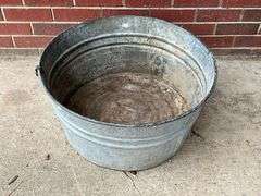 Galvanized tub, no handles, rust in bottom