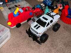 Assortment of toys, Nerf guns, cars, trucks