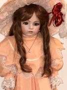 Porcelain doll in peach dress on stand, 24" T