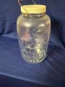 Mason's large glass jar with bail handle, cracked plastic lid