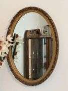 Oval ornate framed mirror, 27" x 18 1/2"