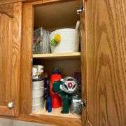 Contents of laundry room, cleaning supplies, light bulbs, ironing board