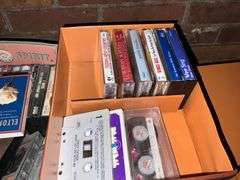Assortment of music cassettes and CDs