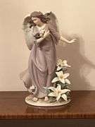 Angel with lilies and roses statue