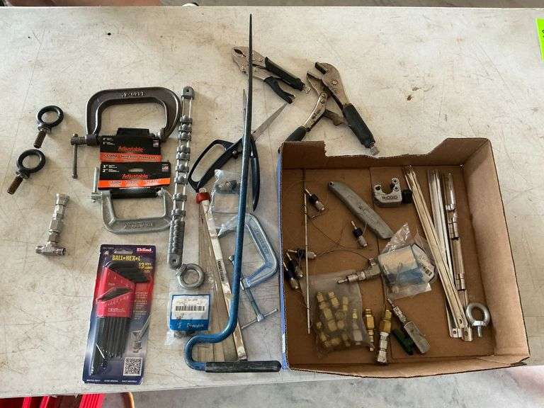 C-clamps, feeler gauges, air line adapters, locking pliers image