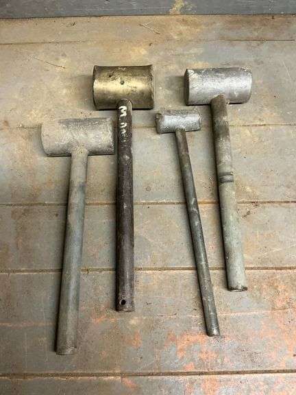 Lead and brass hammers. image