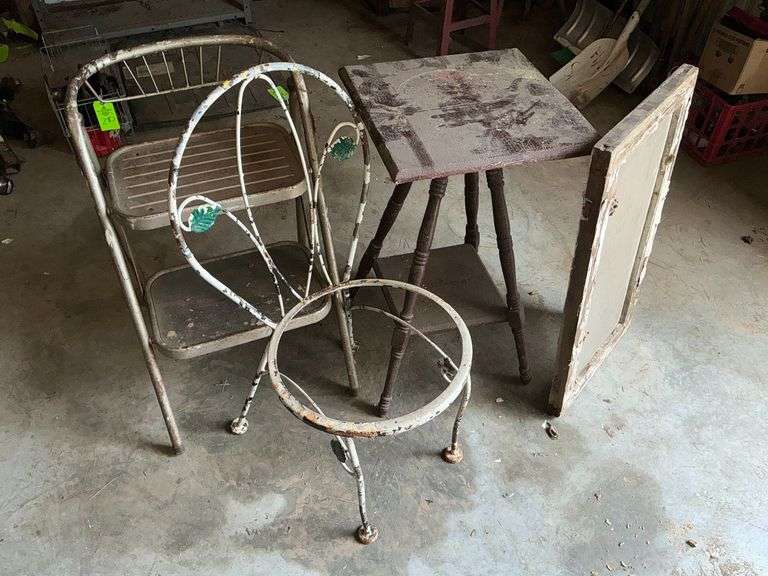 Vintage wooden table, window pane, patio chair without seat, etc. image