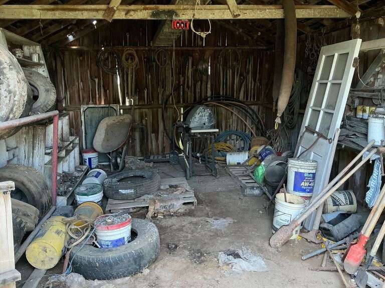 Contents of shed including long handle tools image