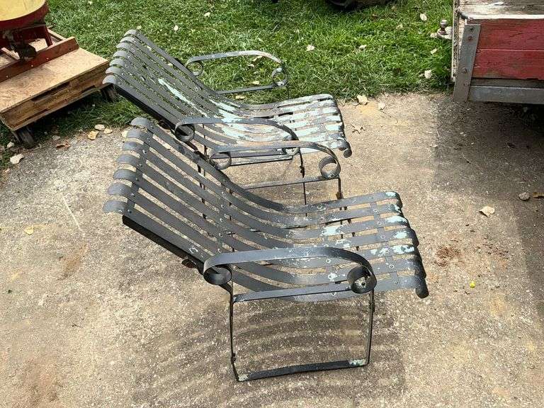 Pair of metal patio chairs. image