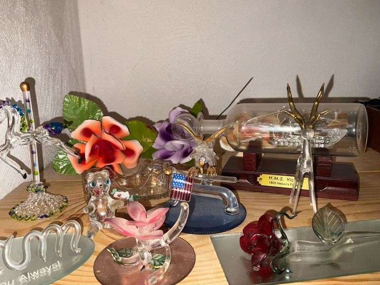 Blown glass pieces, ship in a bottle, porcelain flowers
