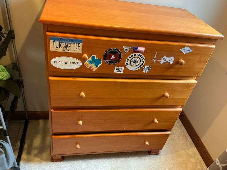4-drawer chest of drawers, one drawer has several stickers image