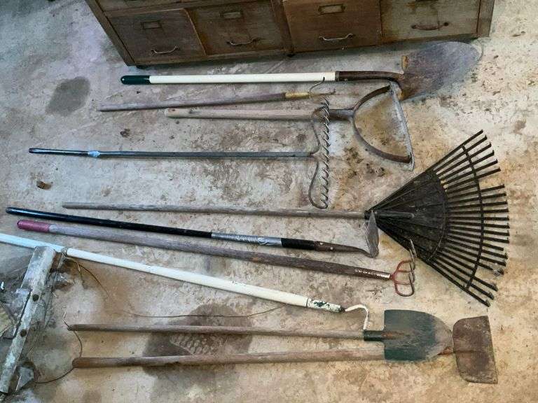 Long handled tools, shovels, rakes, whackers, scrapers image