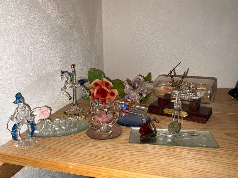 Blown glass pieces, ship in a bottle, porcelain flowers image