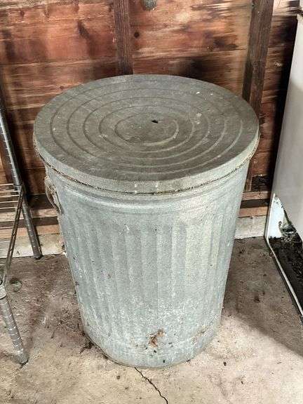 Galvanized trash can, full of black oil sunflower seeds image